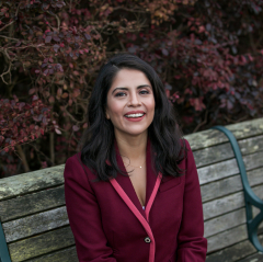 Lupe Rodríguez, Executive Director of the National Latina Institute for Reproductive Justice, smiling in outdoor portrait