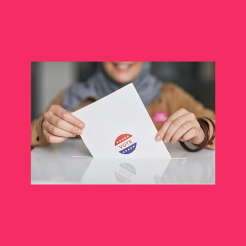 Close up photo of a woman's hands holding a ballot.